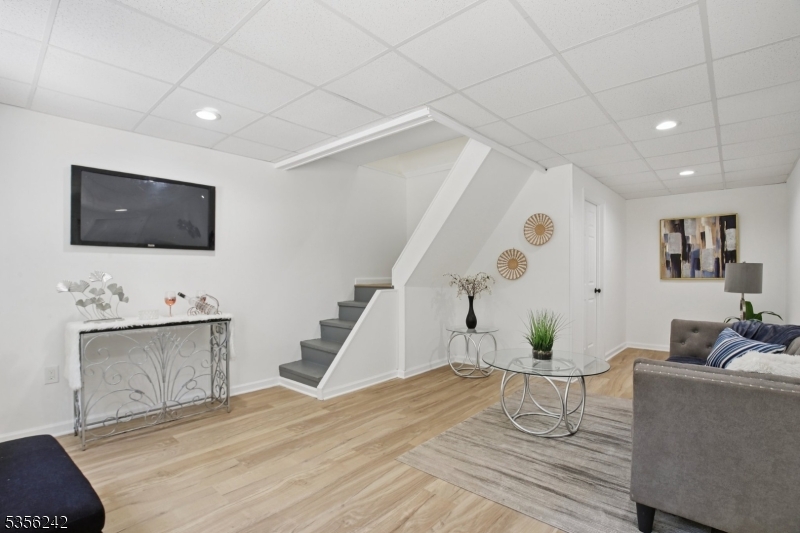 16 Wildcat Road Sparta, NJ 07871 - Photo 4 of 38 a living room with furniture and a flat screen tv