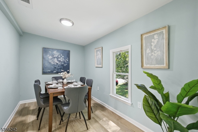 16 Wildcat Road Sparta, NJ 07871 - Photo 7 of 38 a dining room with furniture and wooden floor
