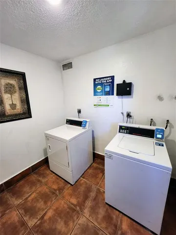 a view of a swimming pool with a yard