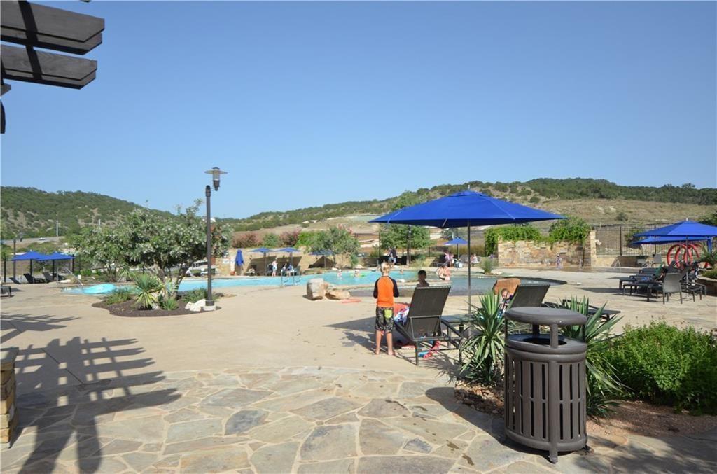 5629 Rio Chama Cove Austin, TX 78738 - Photo 27 of 34 A spacious resort-style pool with ample lounging areas, perfect for relaxation and recreation.