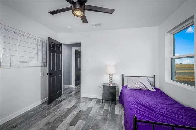 a bathroom with a sink vanity and a mirror