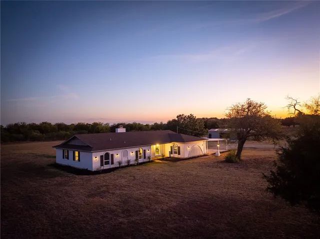 a view of empty room with window and front door