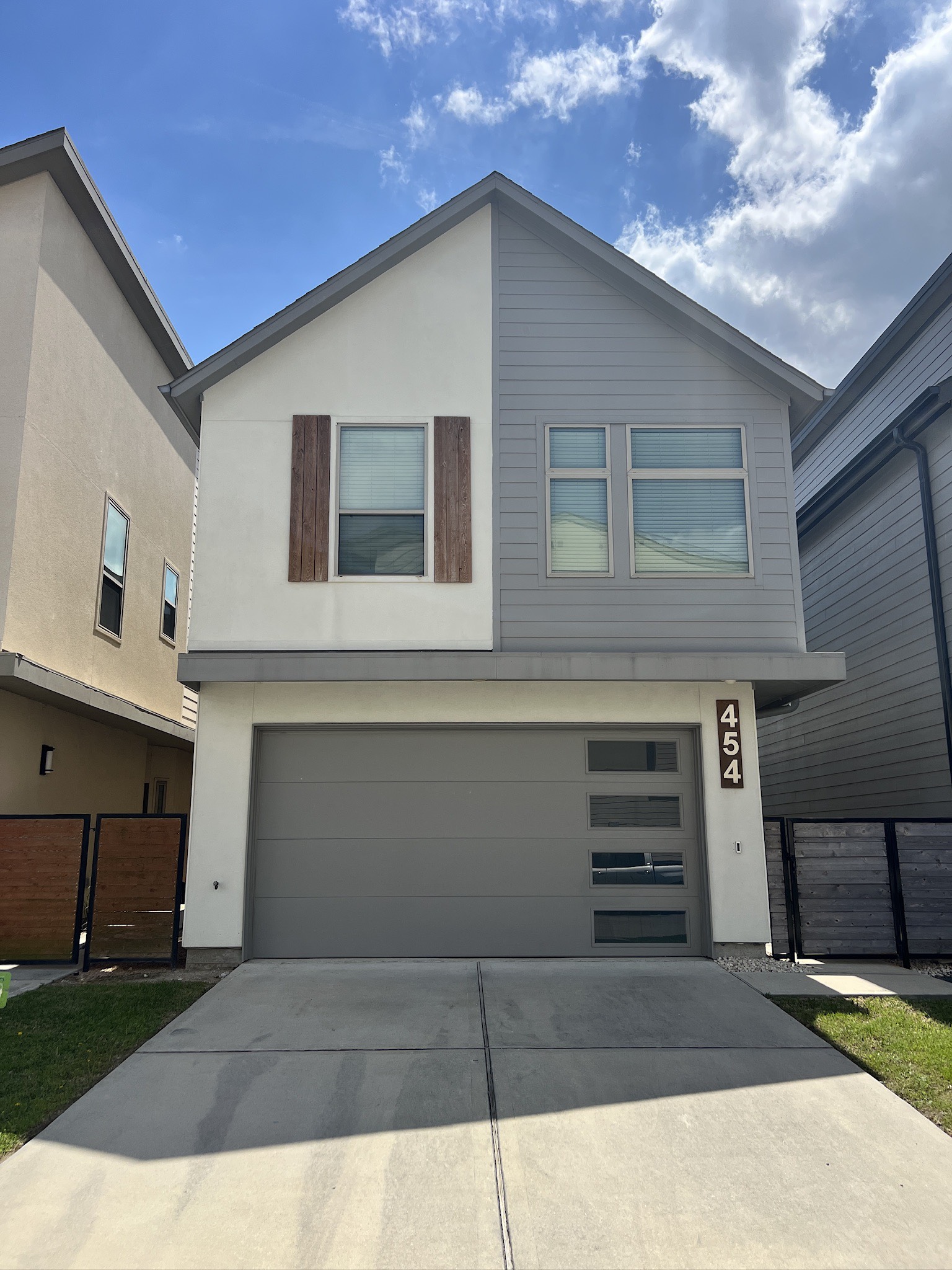 a front view of a house with garage
