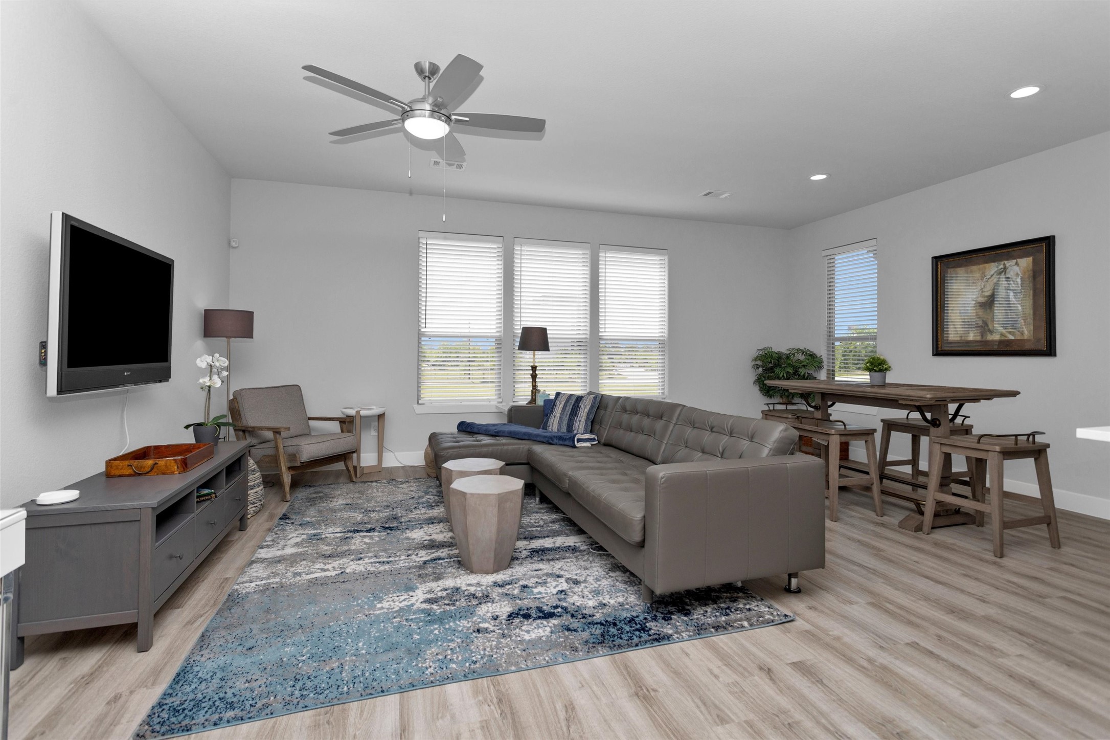 454 South Centro Circle Conroe, TX 77385 - Photo 11 of 34 a living room with furniture and a flat screen tv