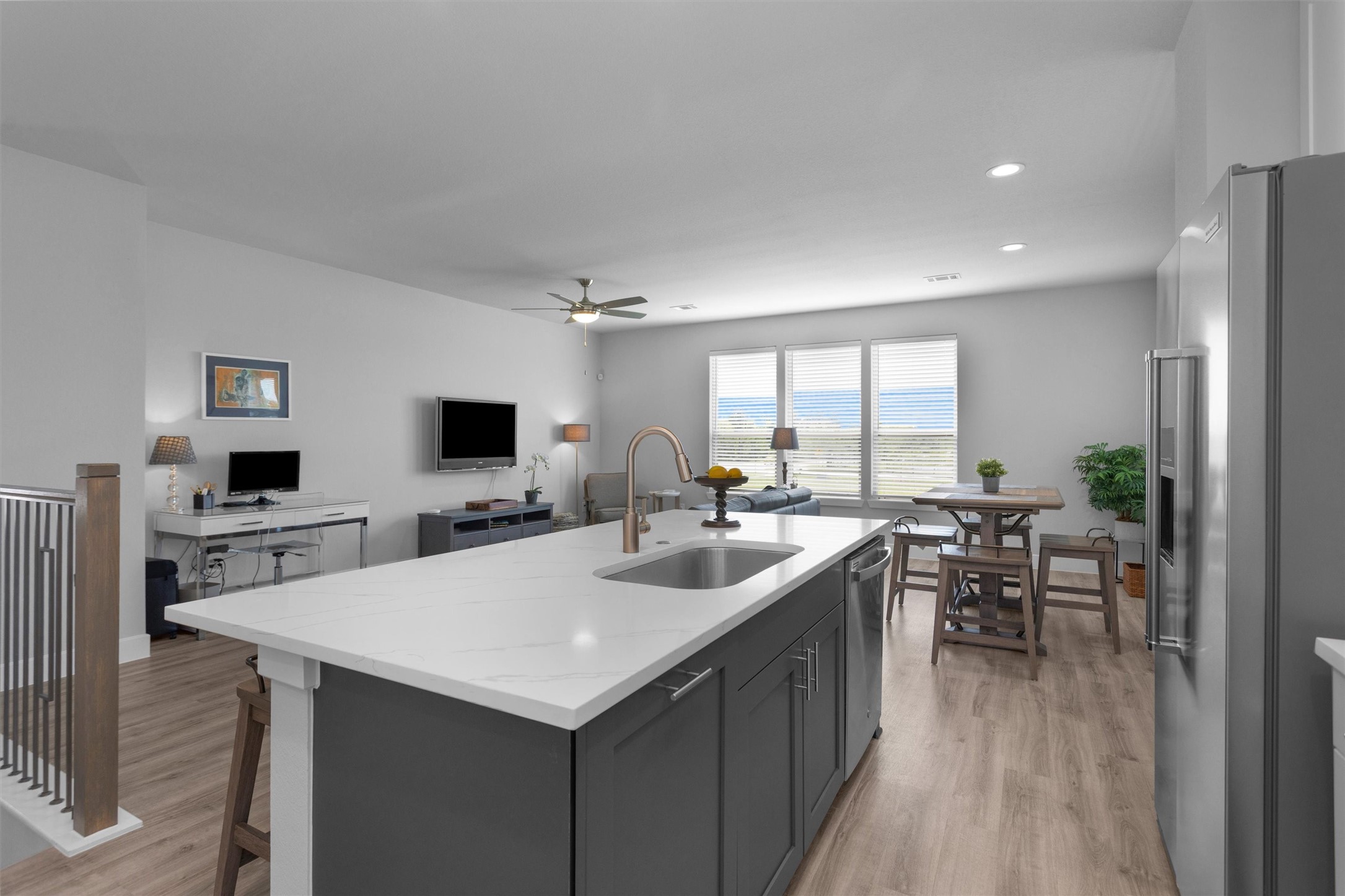 454 South Centro Circle Conroe, TX 77385 - Photo 22 of 34 a kitchen with a sink a counter top space and living room area