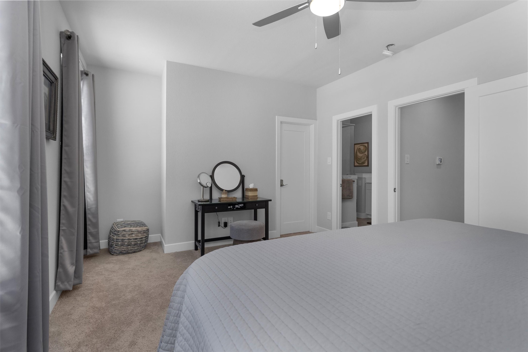 454 South Centro Circle Conroe, TX 77385 - Photo 26 of 34 a bedroom with a bed and a chandelier