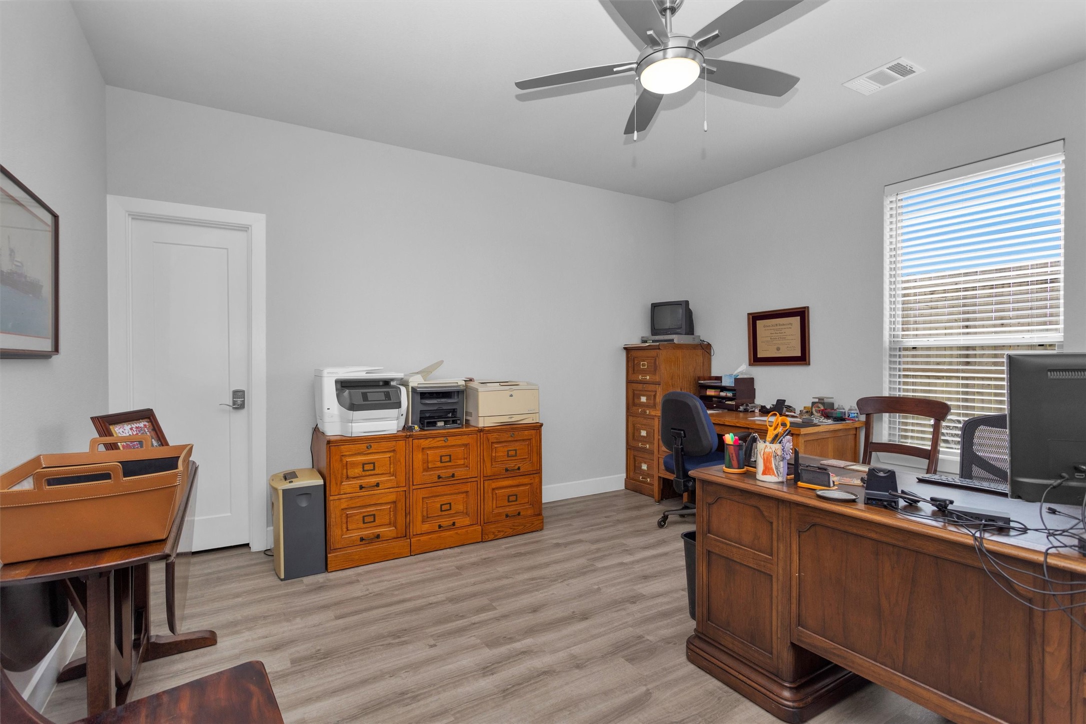 454 South Centro Circle Conroe, TX 77385 - Photo 8 of 34 a work room with furniture and wooden floor