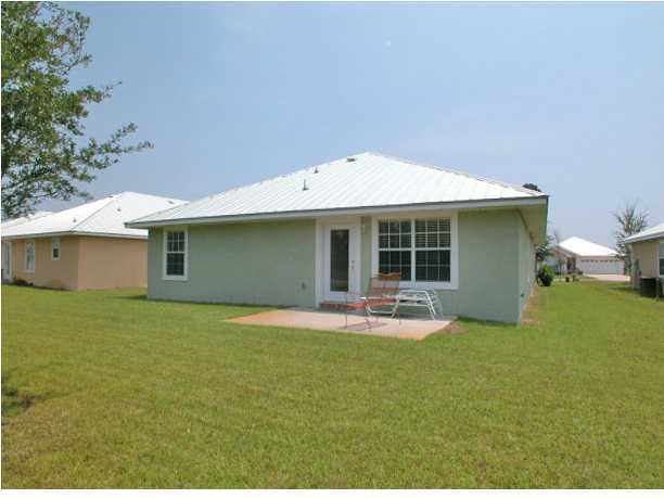 138 South Harborview Road Santa Rosa Beach, FL 32459 - Photo 2 of 12 a house view with a garden space