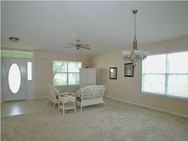 138 South Harborview Road Santa Rosa Beach, FL 32459 - Photo 5 of 12 a view of a livingroom with furniture window and wooden floor