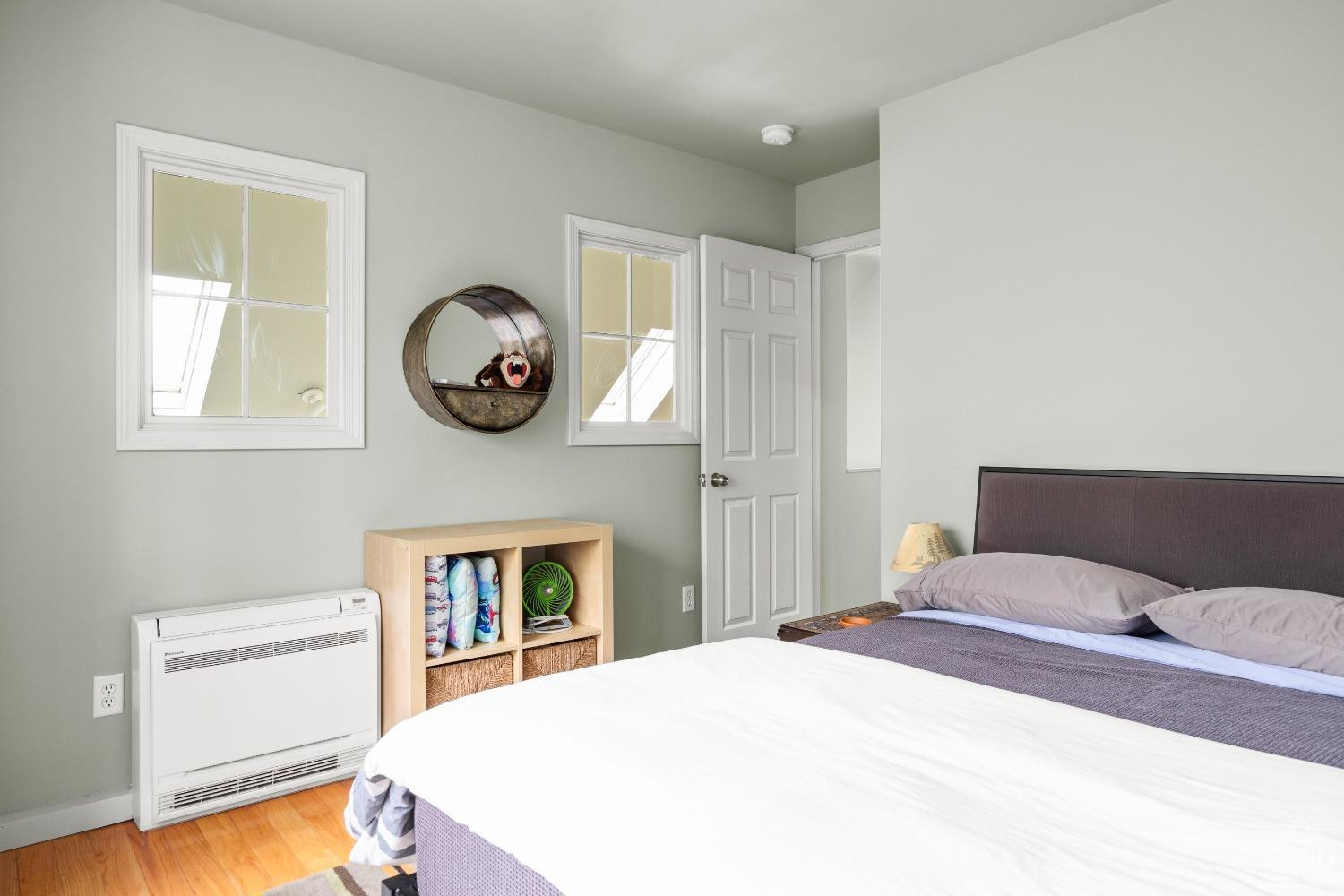 868 Martindale Road Craryville, NY 12521 - Photo 14 of 26 a bedroom with a bed and a chandelier