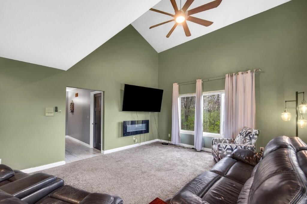 809 West 126th Court Crown Point, IN 46307 - Photo 13 of 47 a living room with furniture and a flat screen tv
