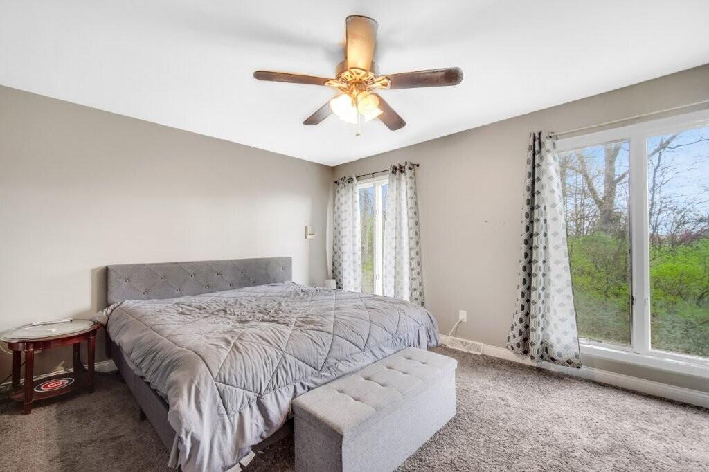 809 West 126th Court Crown Point, IN 46307 - Photo 15 of 47 a bedroom with a bed and a window