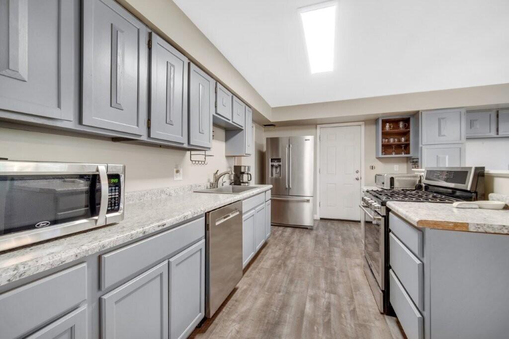 809 West 126th Court Crown Point, IN 46307 - Photo 17 of 47 a kitchen with granite countertop cabinets stainless steel appliances a sink and a counter top space