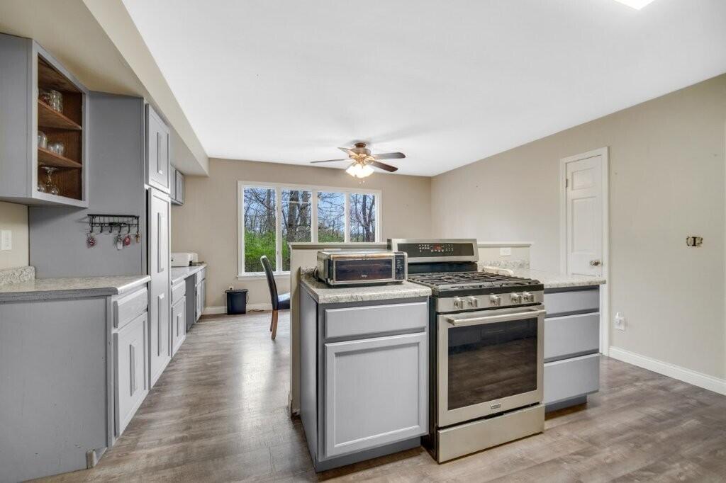 809 West 126th Court Crown Point, IN 46307 - Photo 19 of 47 a kitchen with a stove top oven and sink