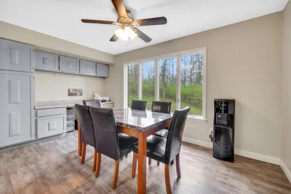a view of a dining room with furniture window and outside view