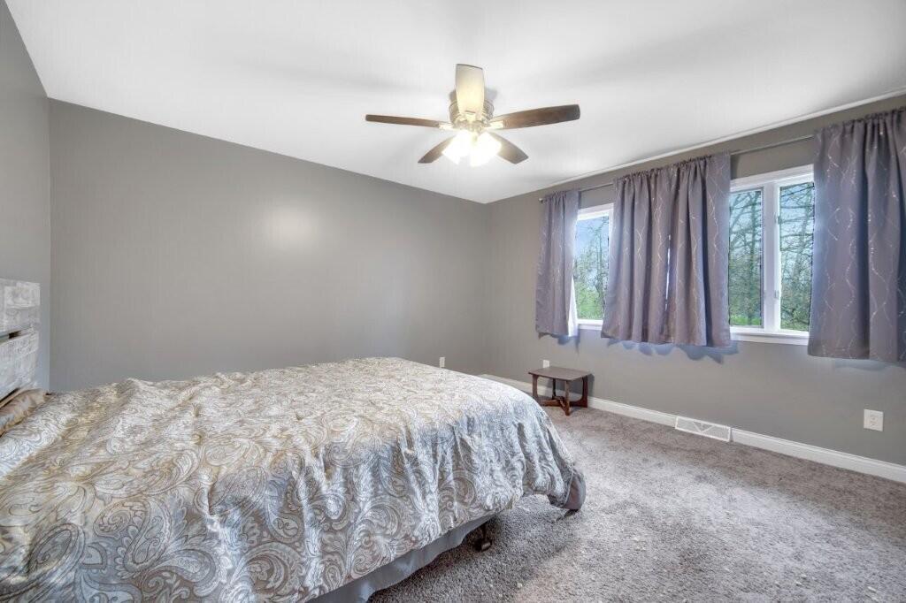 809 West 126th Court Crown Point, IN 46307 - Photo 28 of 47 a bedroom with a bed and window