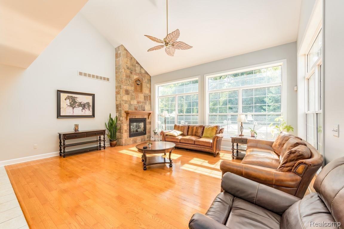 26900 Drake Road Farmington, MI 48331 - Photo 8 of 46 Great room with wood flooring and fireplace