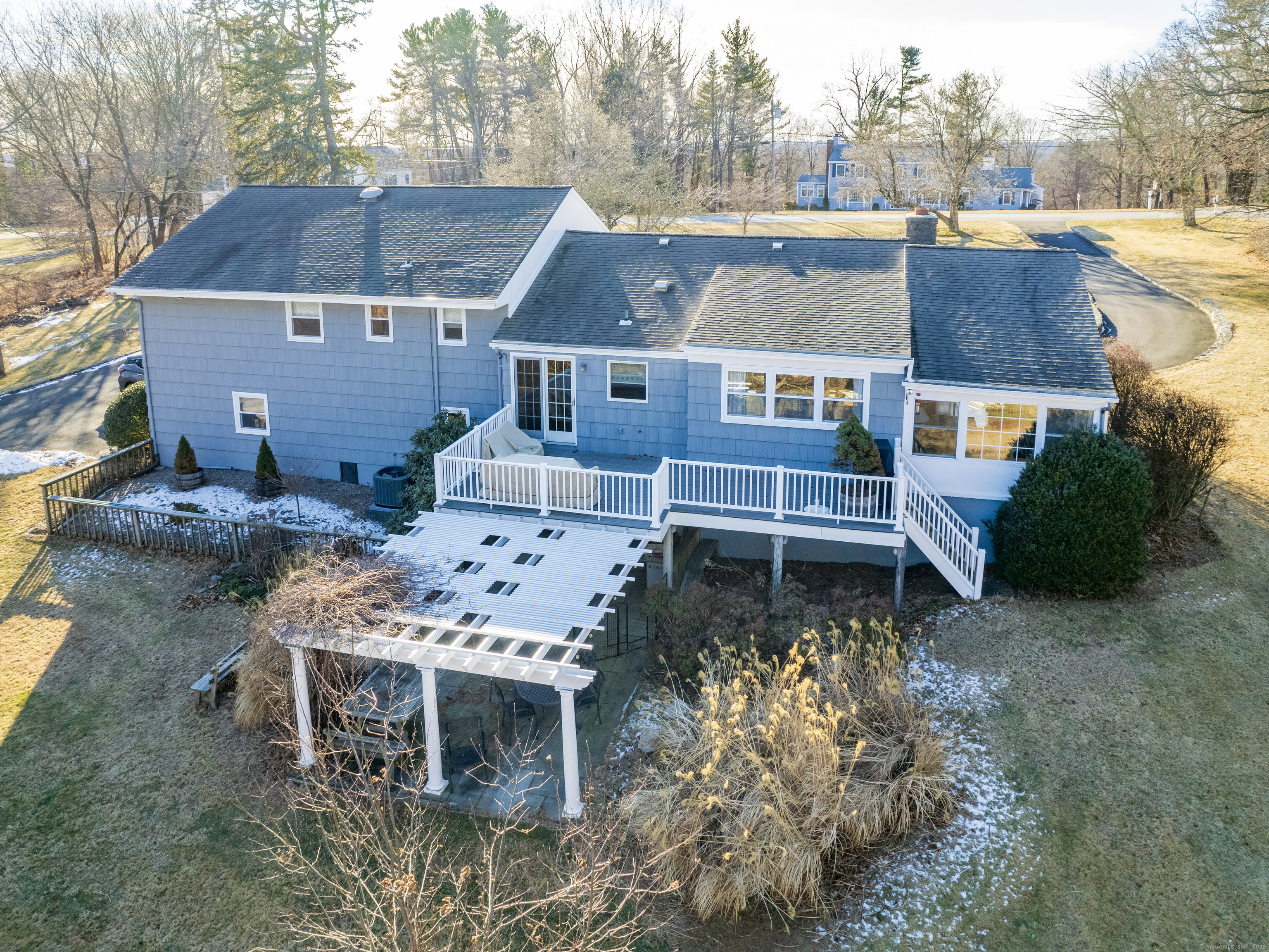 an aerial view of a house with a yard