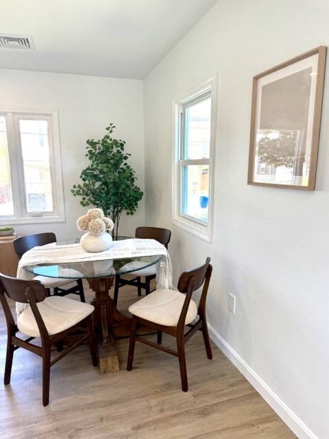 102 Crawford Street Fall River, MA 02724 - Photo 11 of 28 a view of a dining room with furniture window and wooden floor