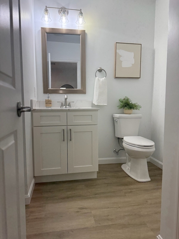 102 Crawford Street Fall River, MA 02724 - Photo 13 of 28 a bathroom with a toilet sink and mirror