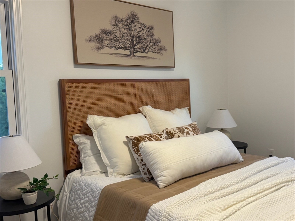 102 Crawford Street Fall River, MA 02724 - Photo 16 of 28 a bedroom with a bed and a painting on the wall