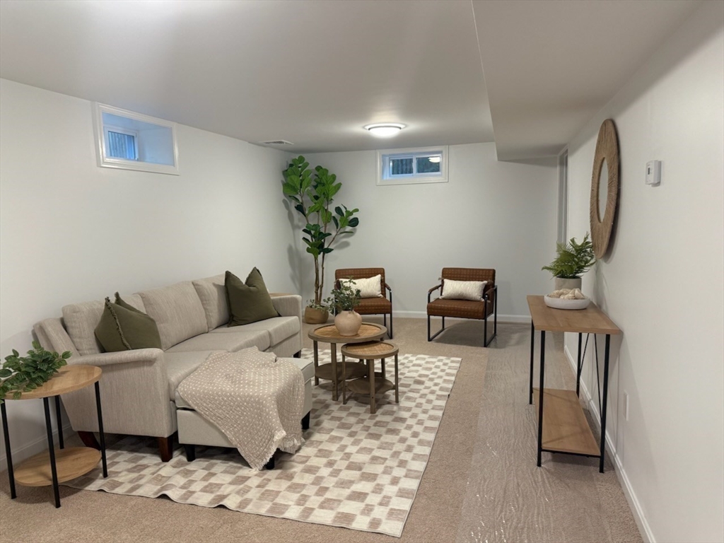 102 Crawford Street Fall River, MA 02724 - Photo 19 of 28 a living room with furniture wooden floor and a potted plant