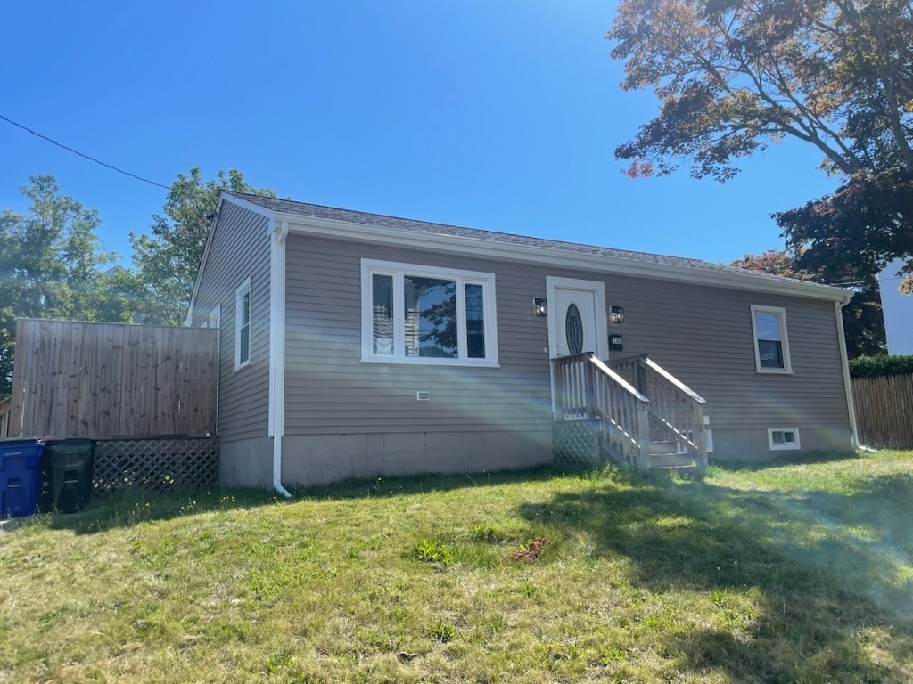 102 Crawford Street Fall River, MA 02724 - Photo 25 of 28 a view of a backyard with a large tree