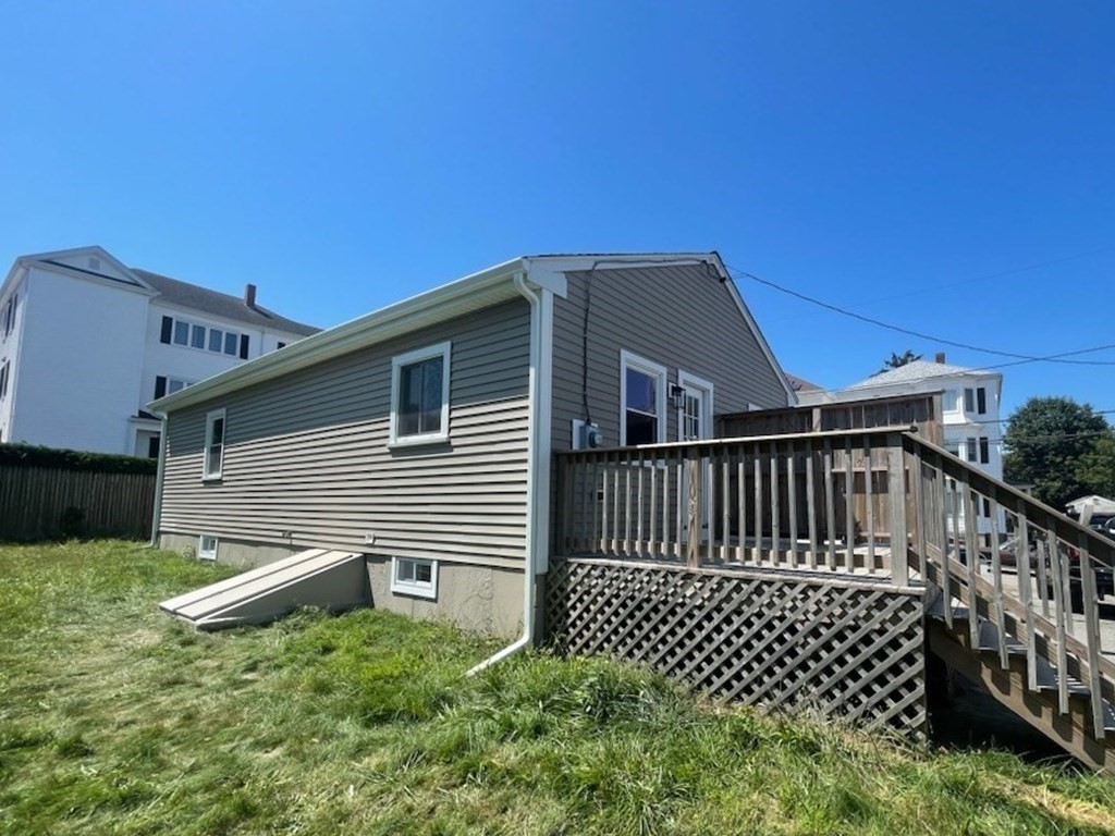 102 Crawford Street Fall River, MA 02724 - Photo 27 of 28 a view of a house with wooden fence