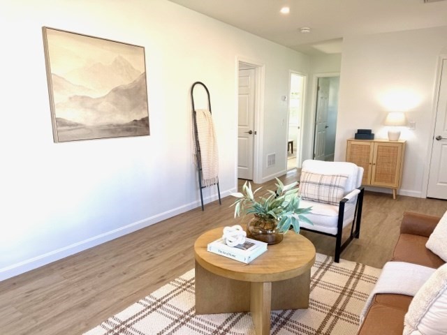 102 Crawford Street Fall River, MA 02724 - Photo 7 of 28 a living room with furniture and a painting on the wall