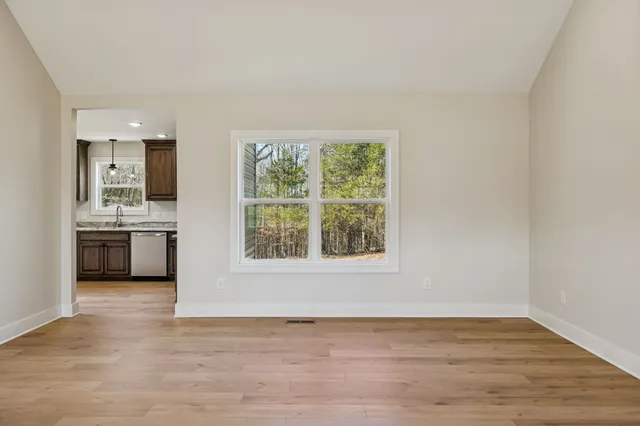 a view of a kitchen with a sink cabinets and a window