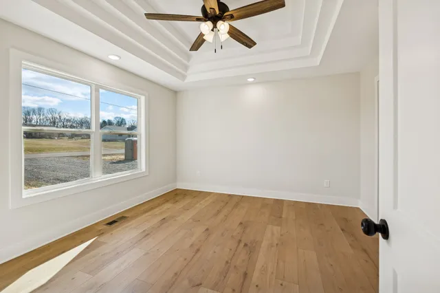a view of an empty room with a window