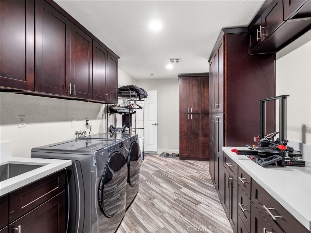 15485 Chole Road Apple Valley, CA 92307 - Photo 29 of 60 a kitchen with refrigerator and cabinets