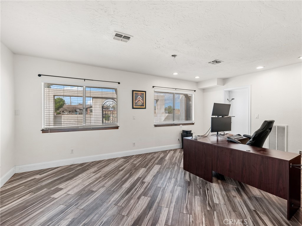 15485 Chole Road Apple Valley, CA 92307 - Photo 31 of 60 a living room with furniture and a wooden floor