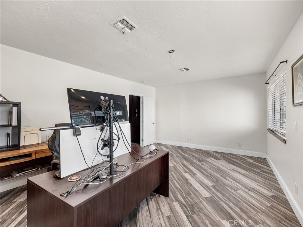 15485 Chole Road Apple Valley, CA 92307 - Photo 32 of 60 a view of a room with gym equipment