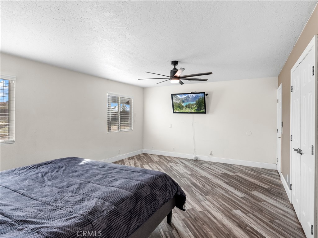 15485 Chole Road Apple Valley, CA 92307 - Photo 34 of 60 a bedroom with bed and cabinets