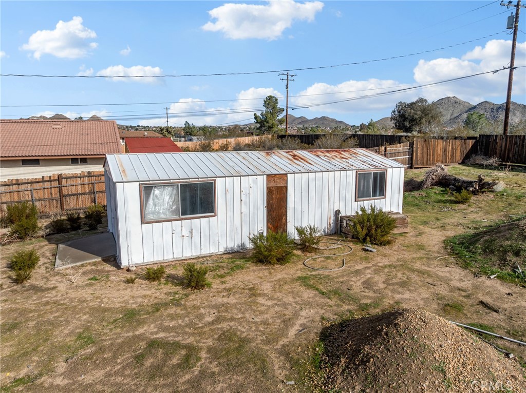 15485 Chole Road Apple Valley, CA 92307 - Photo 39 of 60 a view of a house with a yard