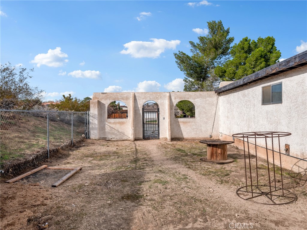 15485 Chole Road Apple Valley, CA 92307 - Photo 47 of 60 a front view of a house with garden