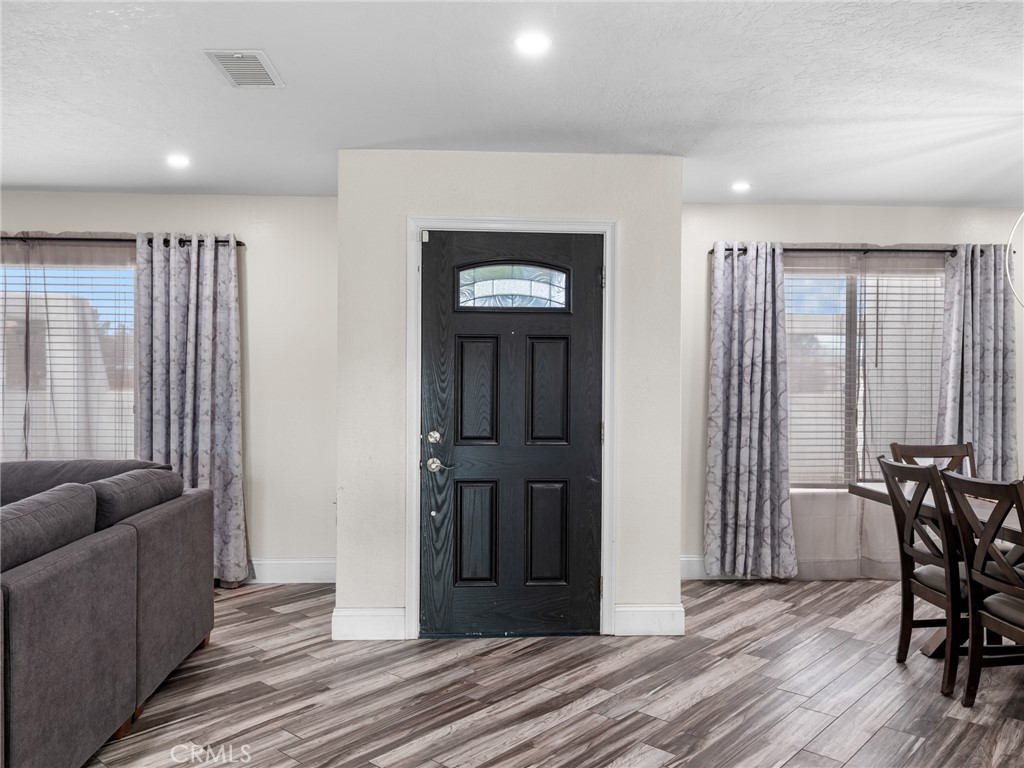 15485 Chole Road Apple Valley, CA 92307 - Photo 10 of 60 a view of a livingroom with furniture and wooden floor