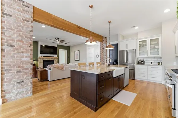 a view of a hallway view with wooden floor and furniture