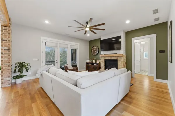 a bathroom with a toilet sink vanity and mirror