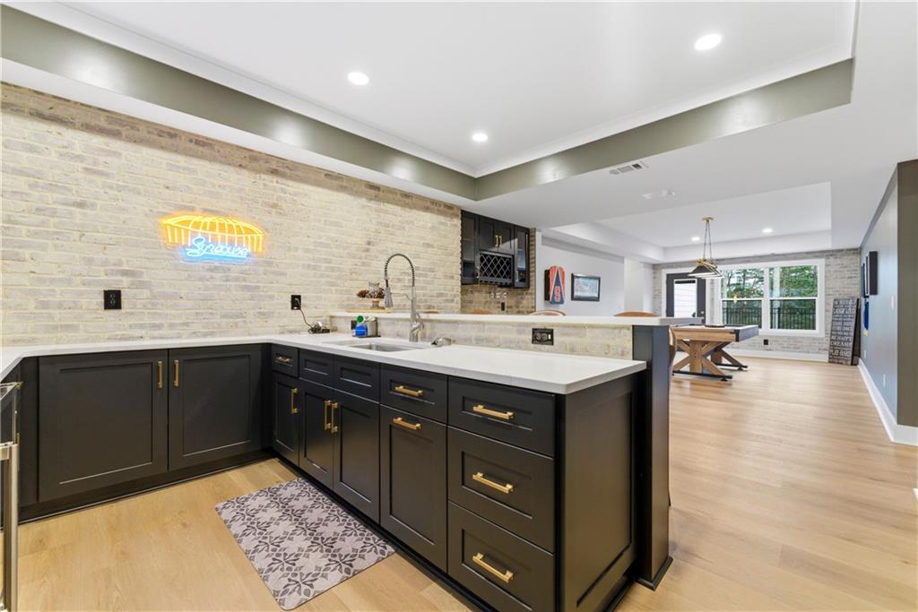 6754 Gaines Ferry Road Flowery Branch, GA 30542 - Photo 54 of 85 a kitchen with a sink and cabinets
