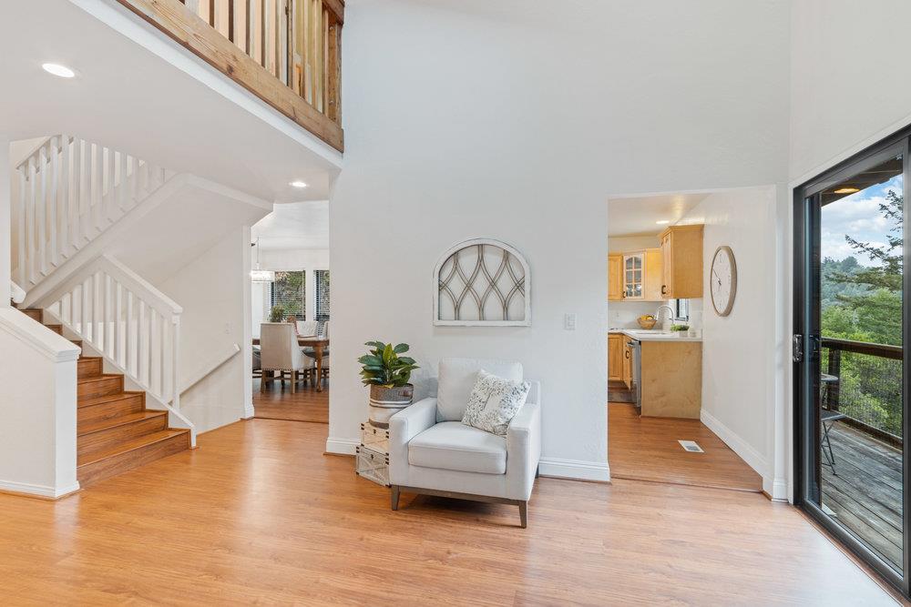 22101 Miller Ridge Road Los Gatos, CA 95033 - Photo 13 of 76 a living room with furniture and a table with wooden floor