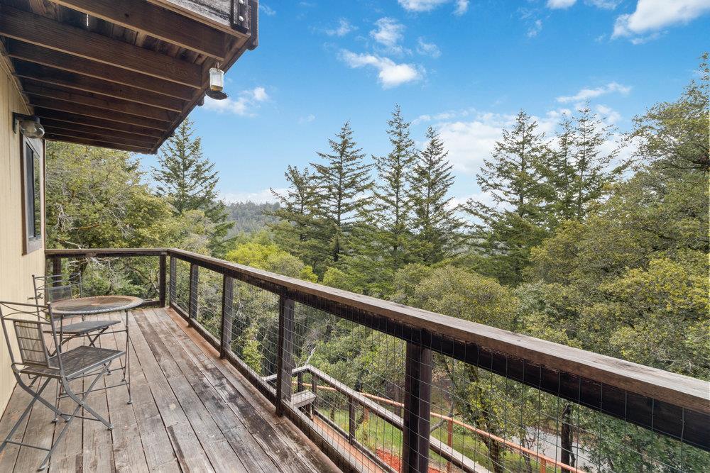 22101 Miller Ridge Road Los Gatos, CA 95033 - Photo 23 of 76 a view of balcony with wooden floor and fence