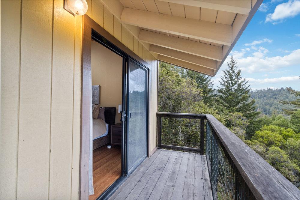 22101 Miller Ridge Road Los Gatos, CA 95033 - Photo 32 of 76 a balcony with wooden floor and outdoor space