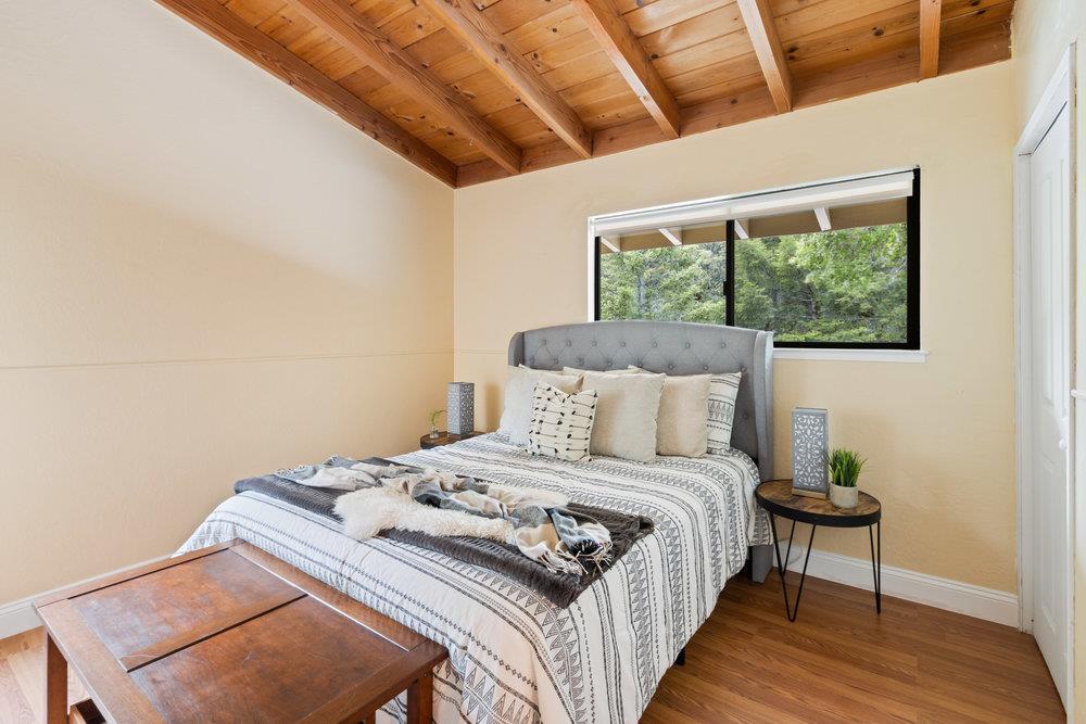 22101 Miller Ridge Road Los Gatos, CA 95033 - Photo 35 of 76 a bedroom with a bed and a window