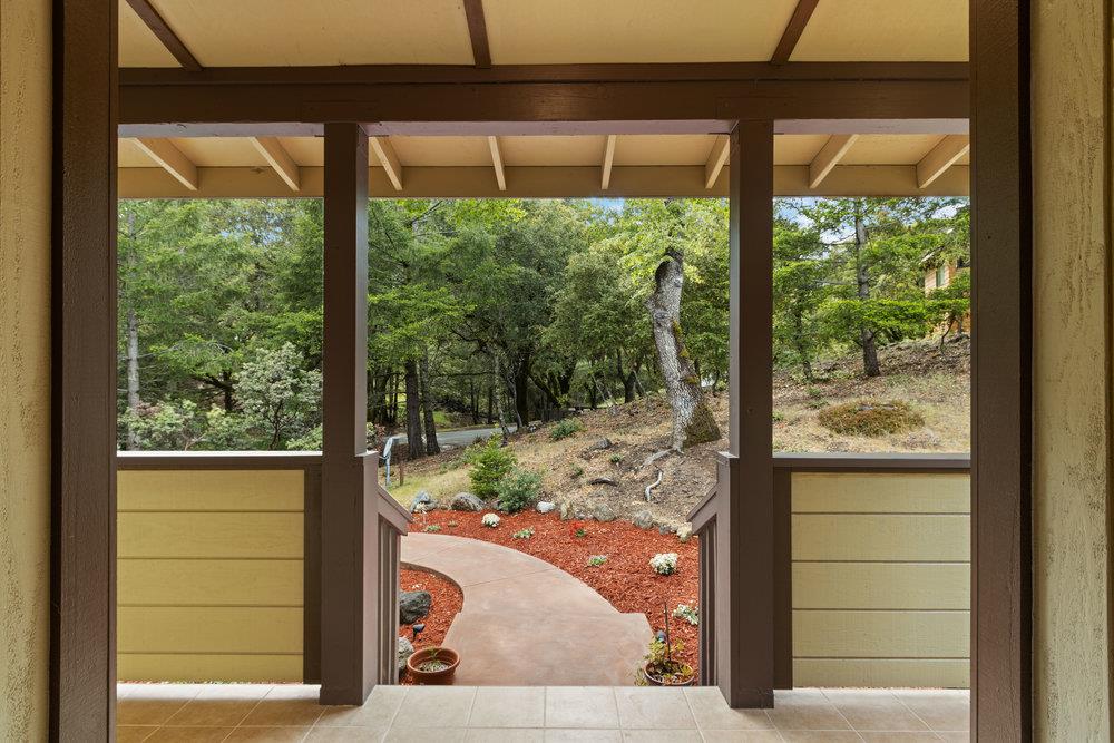22101 Miller Ridge Road Los Gatos, CA 95033 - Photo 4 of 76 a view of a glass door with a tree