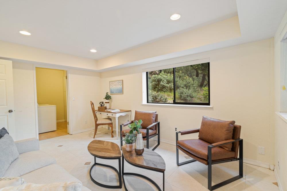 22101 Miller Ridge Road Los Gatos, CA 95033 - Photo 45 of 76 a living room with furniture and a large window