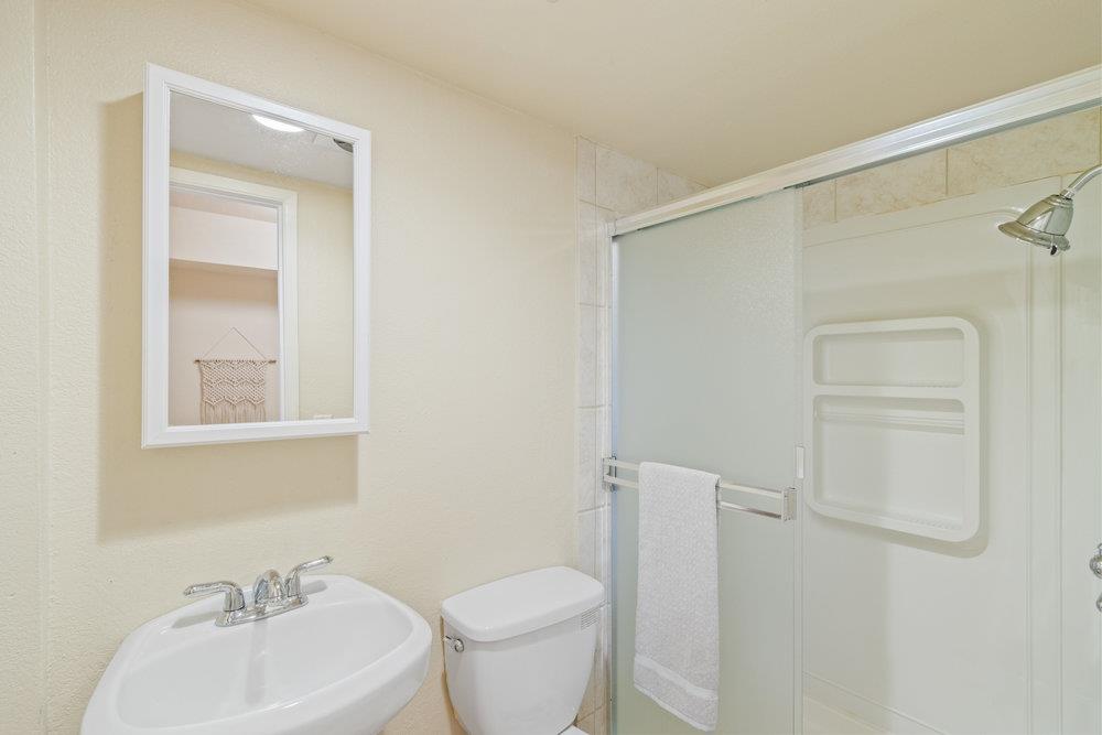 22101 Miller Ridge Road Los Gatos, CA 95033 - Photo 48 of 76 a bathroom with a sink a toilet and shower