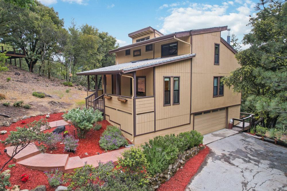 22101 Miller Ridge Road Los Gatos, CA 95033 - Photo 65 of 76 a front view of a house with a yard