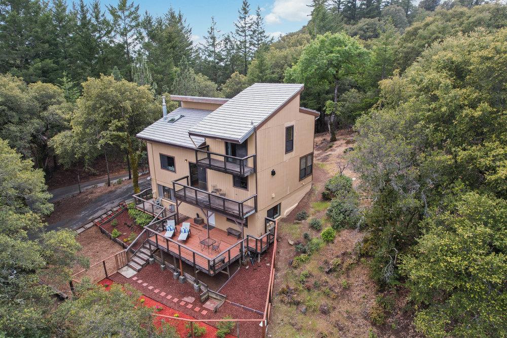 22101 Miller Ridge Road Los Gatos, CA 95033 - Photo 71 of 76 an aerial view of a house with a yard